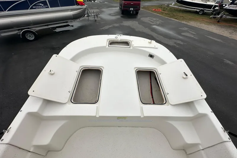 Slide: The Image of Open storage compartment on a 2016 Carolina Skiff 218 DLV boat deck. - 30