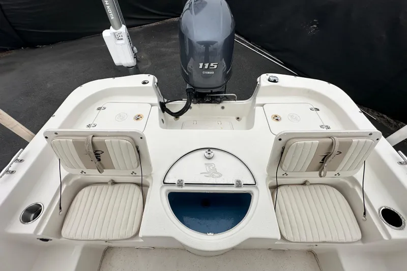 Slide: The Image of 2016 Carolina Skiff 218 DLV boat deck with open storage compartment. - 36