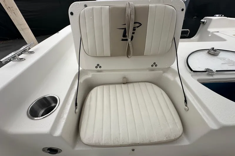 Slide: The Image of Open storage compartment on 2016 Carolina Skiff 218 DLV boat, showing interior details. - 37