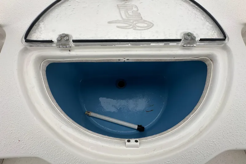 Slide: The Image of 2016 Carolina Skiff 218 DLV boat, spacious deck, center console, outdoor setting. - 38