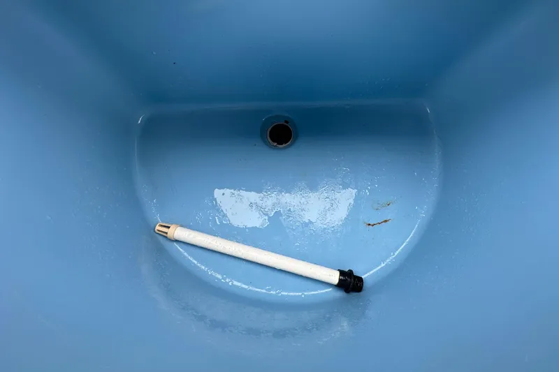 Slide: The Image of 2016 Carolina Skiff 218 DLV boat with canopy, spacious deck, and storage compartments. - 39