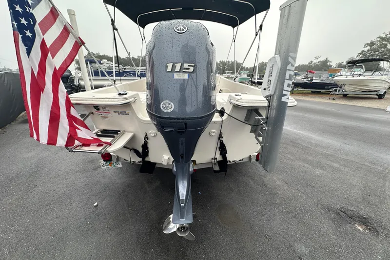 Slide: The Image of 2016 Carolina Skiff 218 DLV boat with Yamaha 115 engine, displayed for sale. - 4