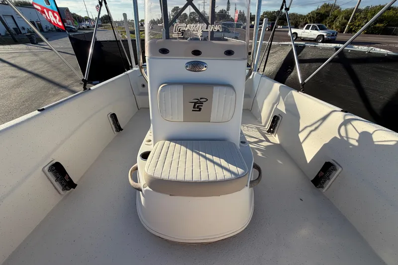 Slide: The Image of 2016 Carolina Skiff 218 DLV boat interior with seating and console. - 42
