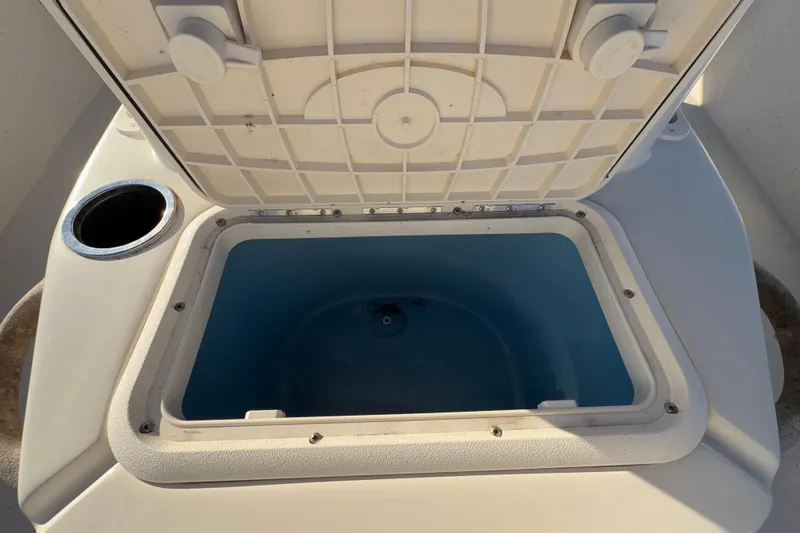 Slide: The Image of Open storage compartment on a 2016 Carolina Skiff 218 DLV boat. - 45