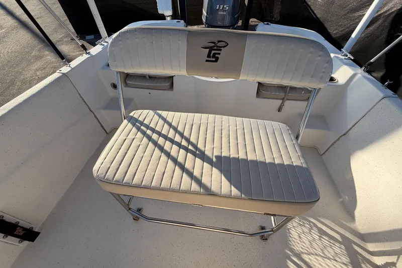 Slide: The Image of 2016 Carolina Skiff 218 DLV boat seat with Yamaha 115 engine in sunlight. - 47