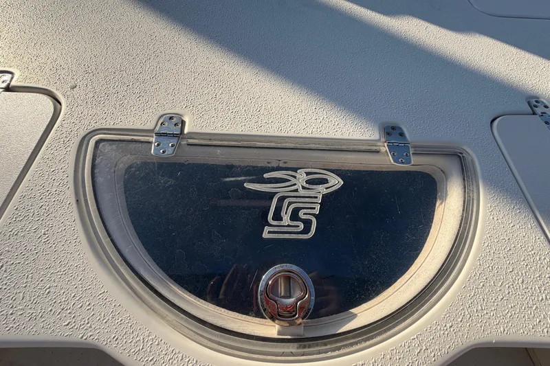 Slide: The Image of 2016 Carolina Skiff 218 DLV boat hatch with logo and textured surface. - 53