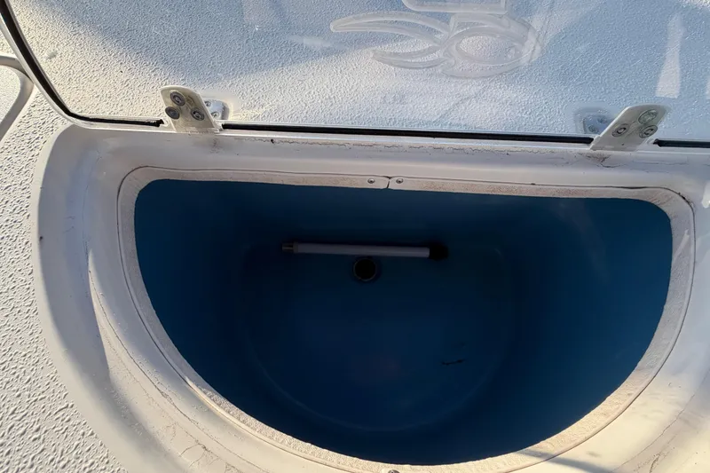Slide: The Image of Open storage compartment on 2016 Carolina Skiff 218 DLV boat. - 54