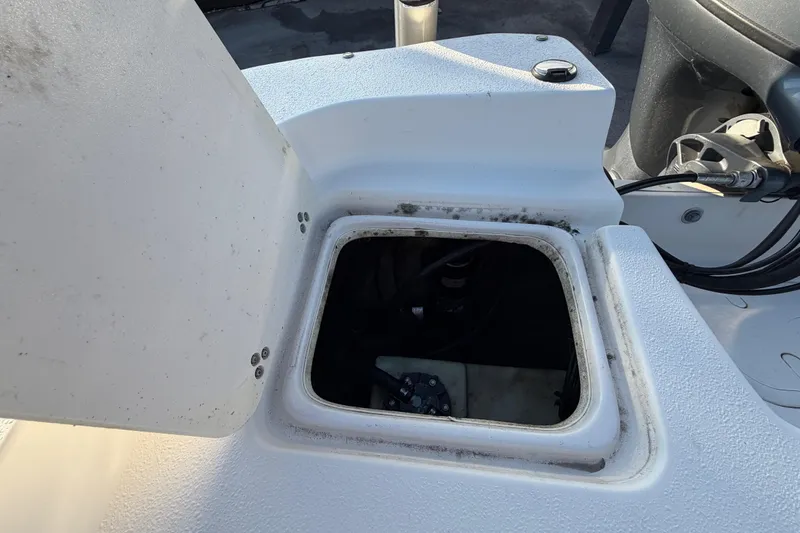 Slide: The Image of Open hatch on 2016 Carolina Skiff 218 DLV boat, showing interior compartment. - 60