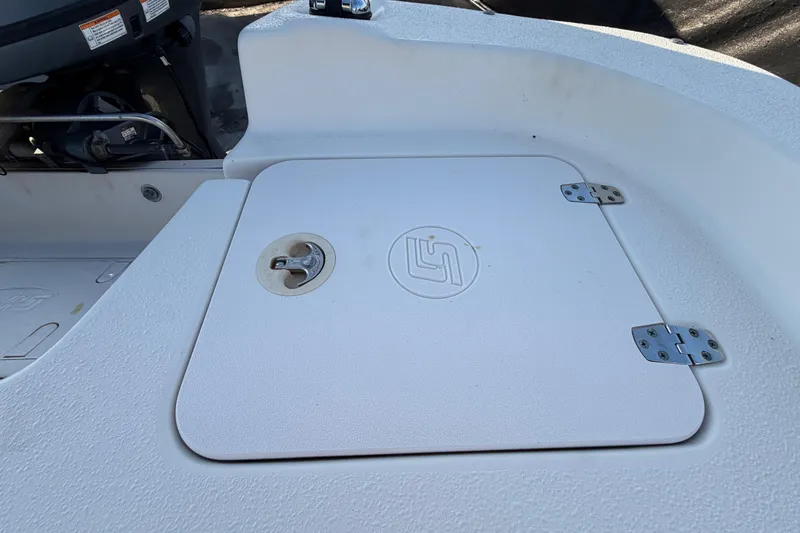 Slide: The Image of 2016 Carolina Skiff 218 DLV boat hatch with secure latch and hinges. - 62