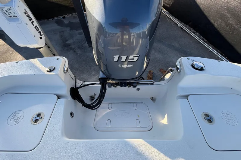 Slide: The Image of 2016 Carolina Skiff 218 DLV boat with Yamaha 115 engine, rear deck view. - 65