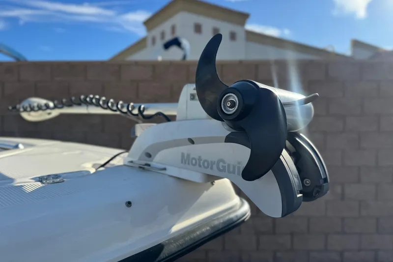 Slide: The Image of 2016 Key West 211 Dual Console with MotorGuide trolling motor, outdoor setting. - 10