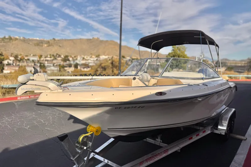 Slide: The Image of 2016 Key West 211 Dual Console boat on trailer, with MotorGuide trolling motor. - 3