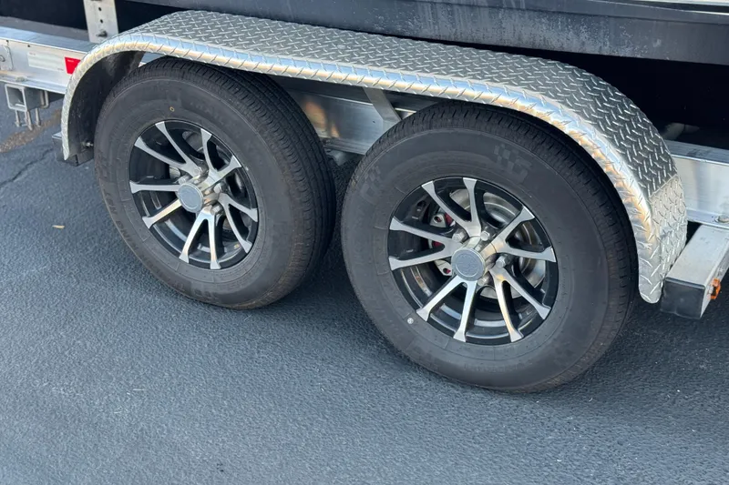 Slide: The Image of Trailer wheels with metallic fender for 2016 Key West 211 Dual Console boat. - 30