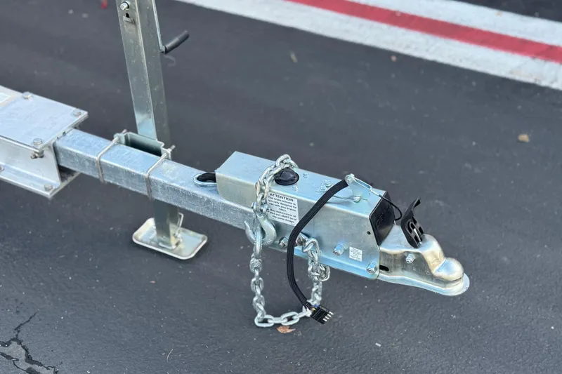 Slide: The Image of Trailer hitch of a 2016 Key West 211 Dual Console on asphalt. - 31