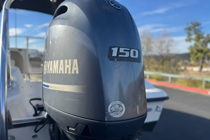 Slide: The Image of Yamaha 150 outboard motor on 2016 Key West 211 Dual Console boat. - 7