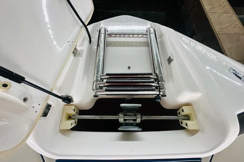 Slide: The Image of 2020 Yamaha Boats 242SE dashboard with steering wheel and digital display in a sleek interior. - 18