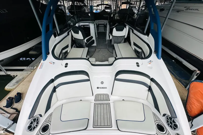 Slide: The Image of Storage compartment in 2020 Yamaha Boats 242SE with life jackets and gear. - 25