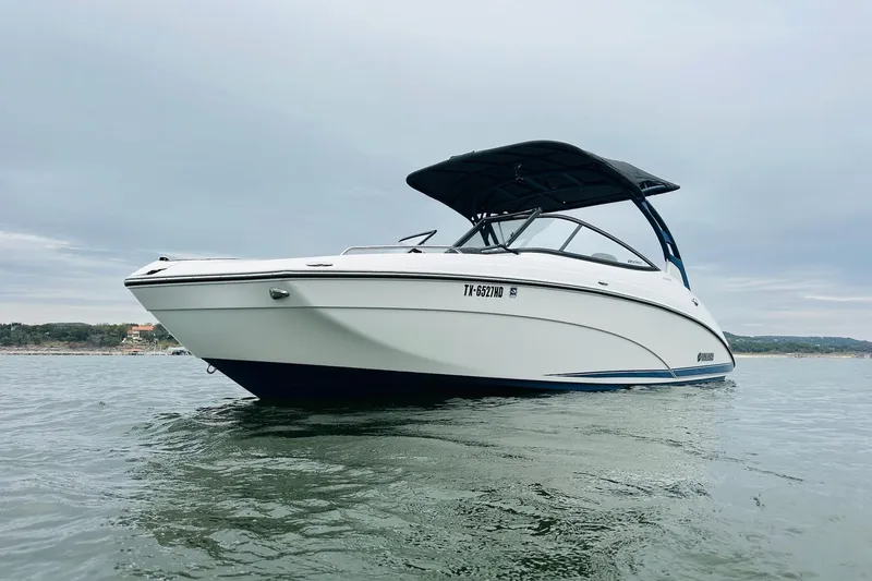 Slide: The Image of 2020 Yamaha Boats 242SE on calm water, showcasing sleek design and modern features. - 8