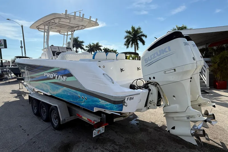 Slide: The Image of 2016 Pro-Line 35 Super Sport boat with Suzuki engines on a trailer. - 10
