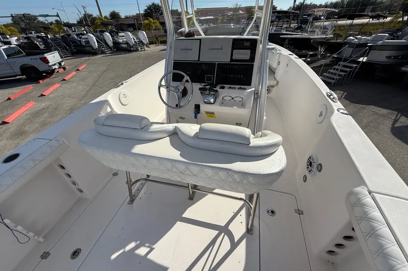 Slide: The Image of 2016 Pro-Line 35 Super Sport boat interior with helm and seating area. - 13