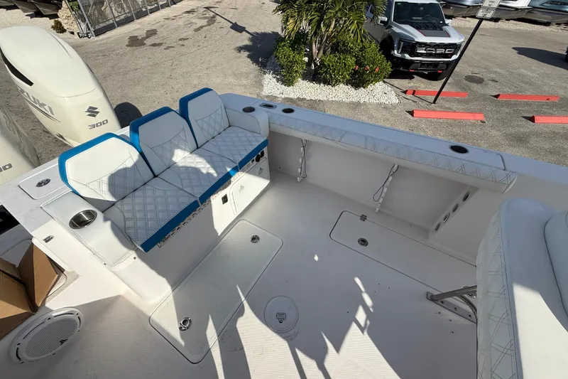 Slide: The Image of 2016 Pro-Line 35 Super Sport boat interior with seating and Suzuki 300 engines. - 14