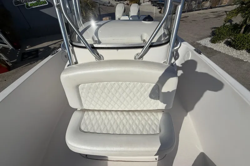 Slide: The Image of 2016 Pro-Line 35 Super Sport boat with white cushioned seating and stainless steel railings. - 18