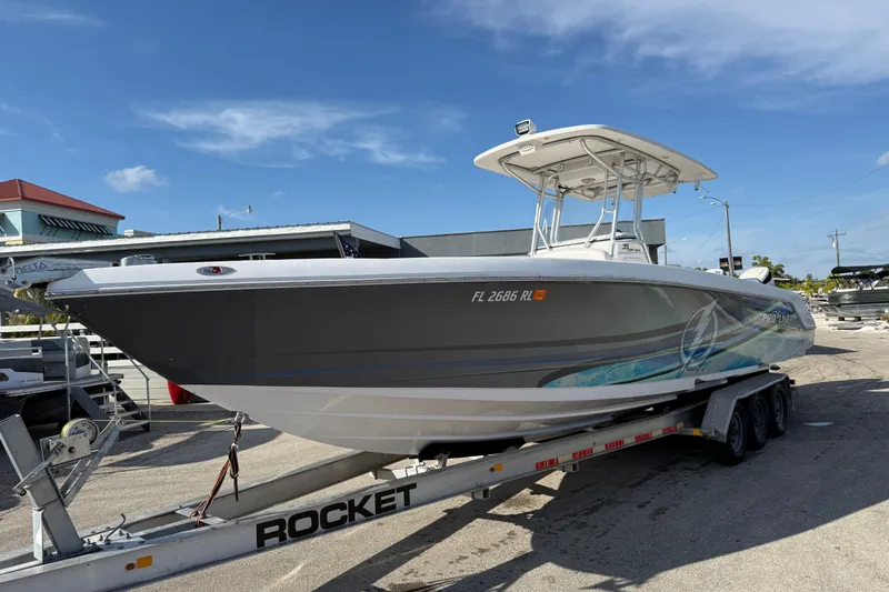 Slide: The Image of 2016 Pro-Line 35 Super Sport boat on trailer under clear blue sky. - 2
