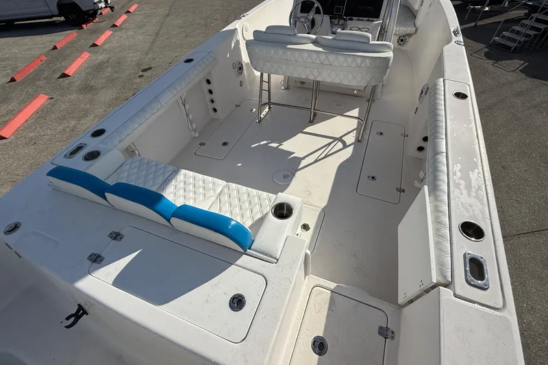 Slide: The Image of 2016 Pro-Line 35 Super Sport boat interior with white and blue seating. - 27