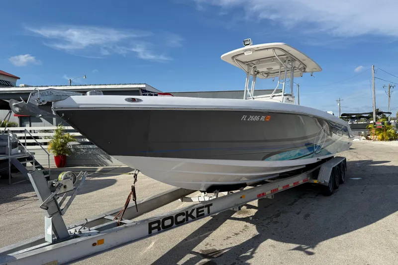 Slide: The Image of 2016 Pro-Line 35 Super Sport boat on trailer, parked outdoors under clear sky. - 3