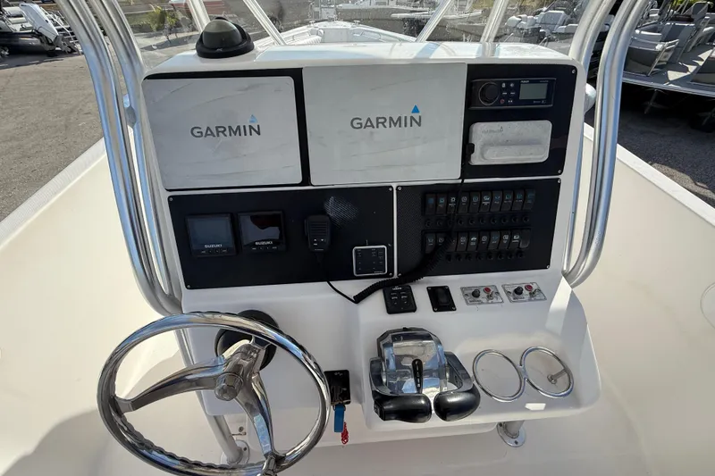 Slide: The Image of 2016 Pro-Line 35 Super Sport boat dashboard with Garmin navigation system and controls. - 34