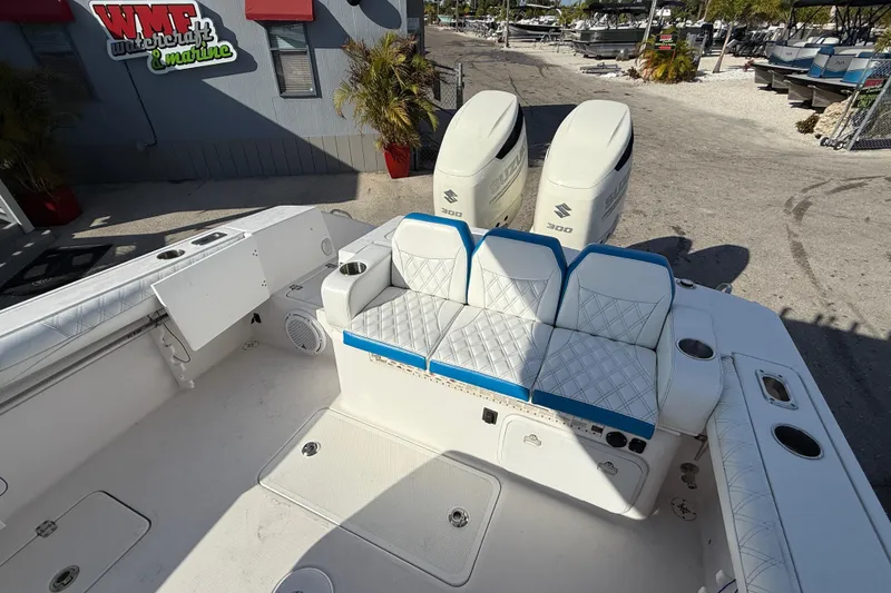 Slide: The Image of 2016 Pro-Line 35 Super Sport boat with dual Suzuki engines and cushioned seating. - 35