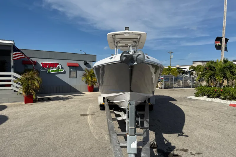 Slide: The Image of 2016 Pro-Line 35 Super Sport boat on trailer at dealership, sunny day. - 4