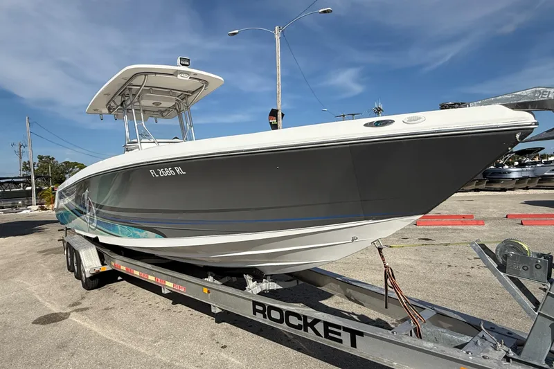 Slide: The Image of 2016 Pro-Line 35 Super Sport boat on trailer under clear blue sky. - 5