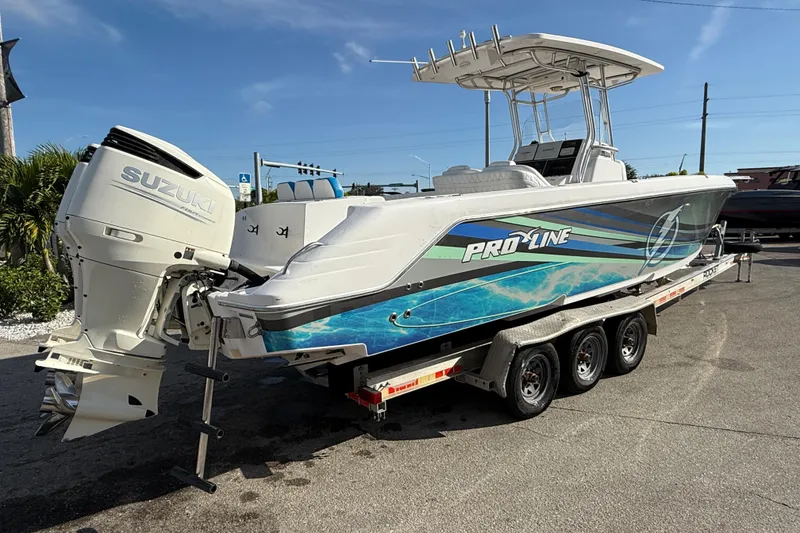 Slide: The Image of 2016 Pro-Line 35 Super Sport boat on trailer with Suzuki outboard motor. - 7