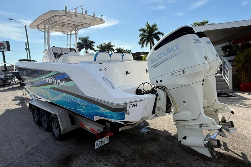 Slide: The Image of 2016 Pro-Line 35 Super Sport boat with dual Suzuki engines on a trailer. - 9