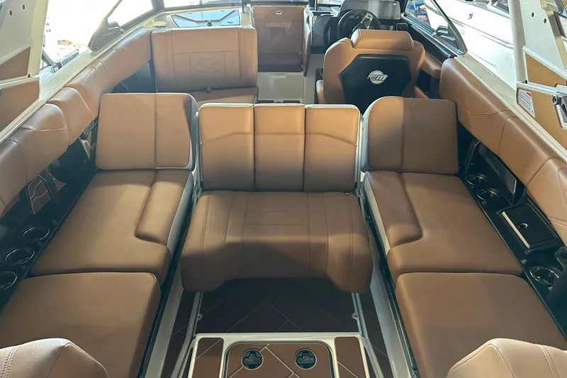 Slide: The Image of 2026 Malibu Wakesetter 23 LSV interior with luxurious tan seating and modern design. - 13