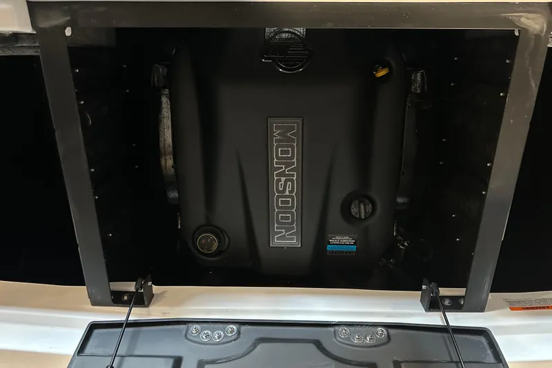 Slide: The Image of 2026 Malibu Wakesetter 23 LSV engine compartment with Monsoon engine visible. - 19