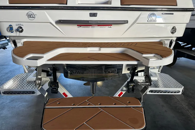 Slide: The Image of 2026 Malibu Wakesetter 23 LSV boat rear view with swim platform and step. - 3