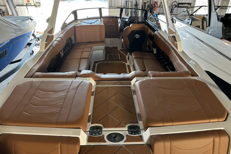 Slide: The Image of 2026 Malibu Wakesetter 23 LSV interior with luxurious brown leather seating. - 5