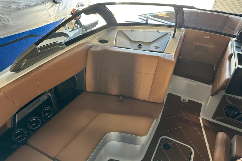 Slide: The Image of 2026 Malibu Wakesetter 23 LSV interior with brown leather seating and modern design. - 8