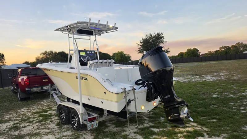 Slide: The Image of 2008 Sea Fox 216 boat on trailer at sunset. - 4