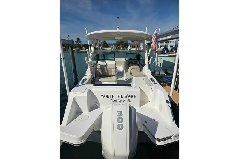 Slide: The Image of 2021 Boston Whaler 240 Vantage boat docked, featuring "Worth the Wake" nameplate. - 11