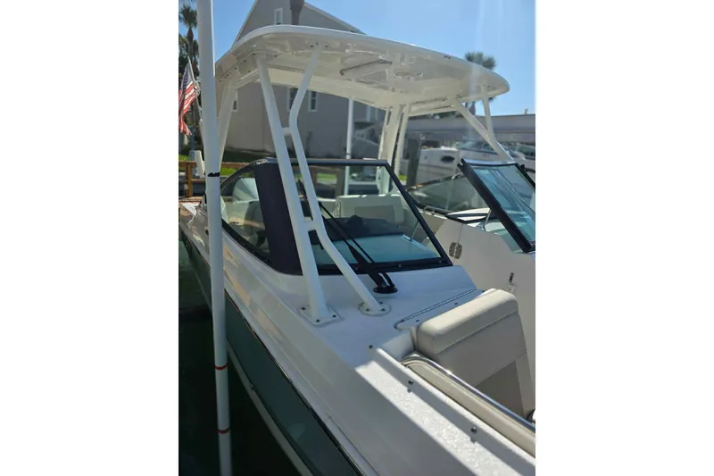 Slide: The Image of 2021 Boston Whaler 240 Vantage boat with sleek design and modern features. - 13