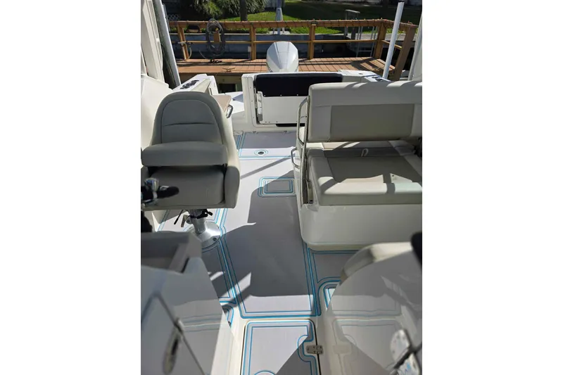 Slide: The Image of 2021 Boston Whaler 240 Vantage boat interior with seating and deck view. - 19