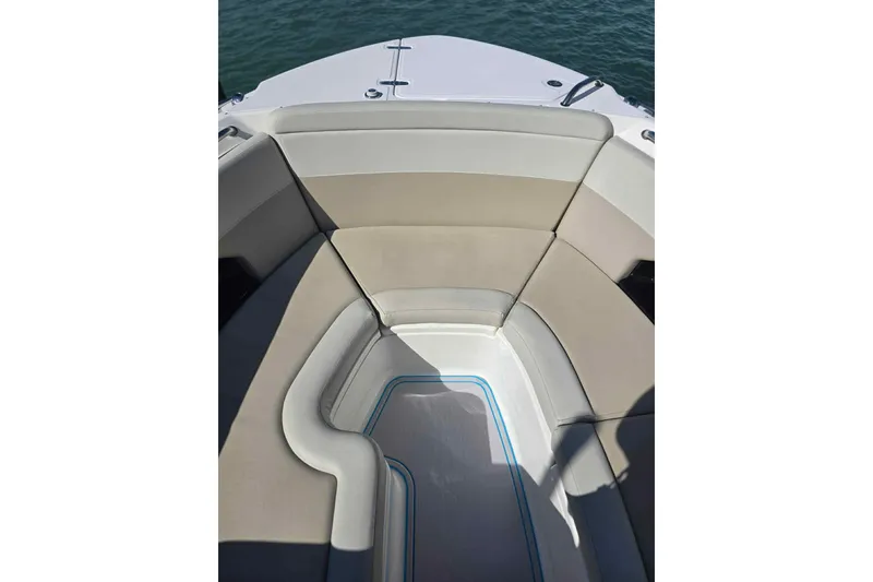 Slide: The Image of 2021 Boston Whaler 240 Vantage boat interior with cushioned seating and sleek design. - 23