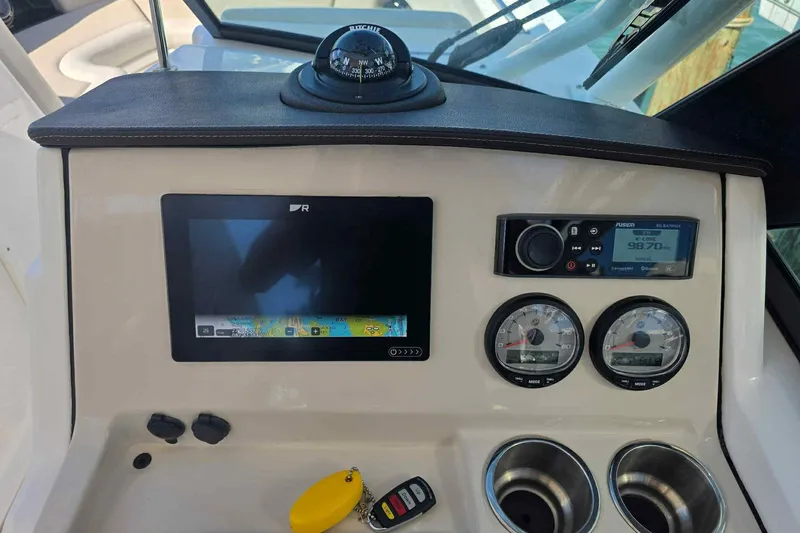 Slide: The Image of Control panel of 2021 Boston Whaler 240 Vantage with navigation and audio systems. - 39