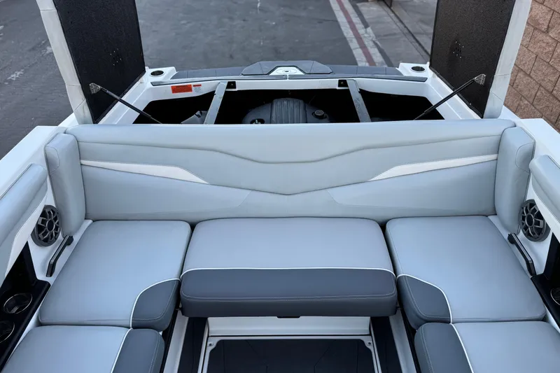 Slide: The Image of 2023 Axis T220 boat interior with gray seating and open engine compartment. - 18