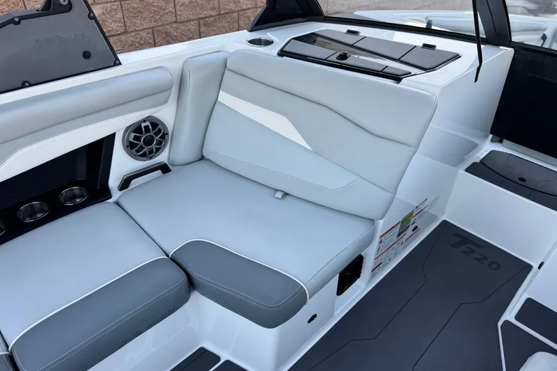 Slide: The Image of 2023 Axis T220 boat interior with gray seating and speaker system. - 22