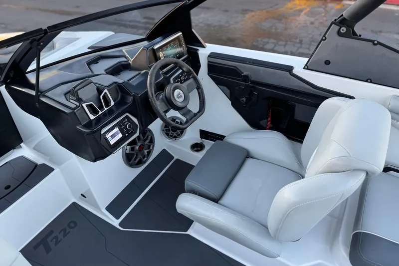 Slide: The Image of 2023 Axis T220 boat interior with modern dashboard and comfortable seating. - 25