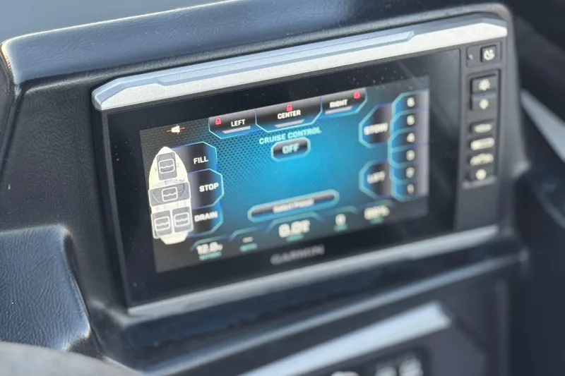 Slide: The Image of 2023 Axis T220 dashboard display showing cruise control and boat settings. - 28